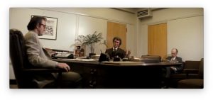 "Dirty Harry" (Clint Eastwood) sits across the desk from the San Francisco District Attorney with a Court of Appeal Judge sitting behind him and giving him a legal opinion on the admissibility of evidence in his pending murder case; something that would never happen in the real world