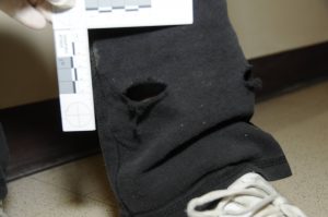 Photo of Bullet path through Penny Trent's pants fired by Deputy