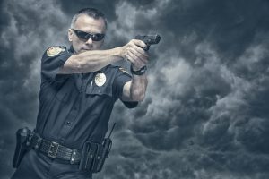 Policeman shooting his pistol