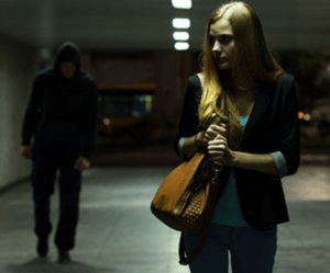 Photo of man stalking woman