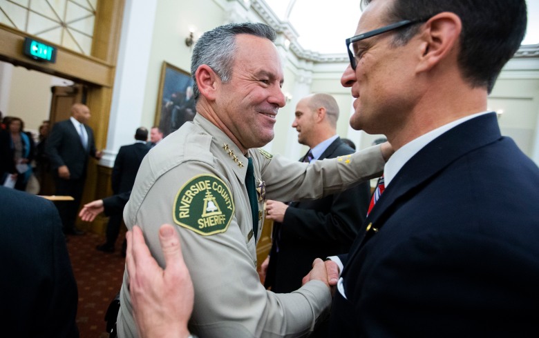 Riverside County Sheriff Chad Bianco and Riverside County District Attorney Mike Hestrin exchange pleasantries