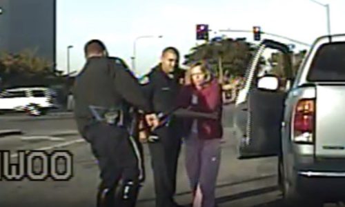 Robin Winger is taken from her truck during DUI arrest by Garden Grover officers. (Courtesy of Attorney Jerry Steering)