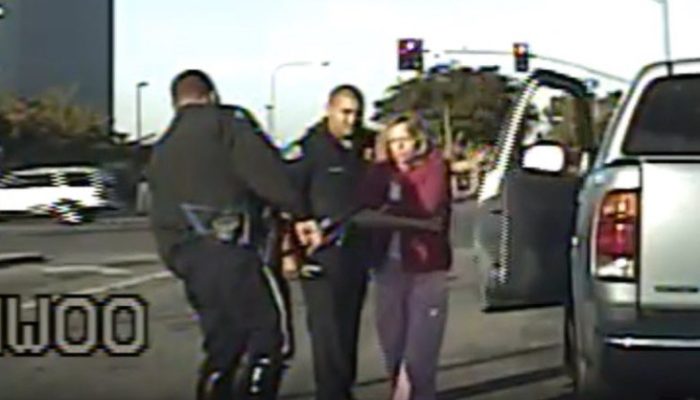 Robin Winger is taken from her truck during DUI arrest by Garden Grover officers. (Courtesy of Attorney Jerry Steering)