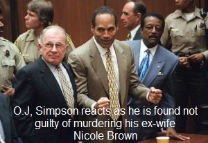O.J. Simpson reacts as he is found not guilty of murdering his ex-wife Nicole Brown