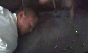 Matthew Krechmery lightened - on the floor of his home after being struck with an Ontario Police Officer's gun.