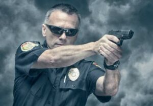 Ontario Cop pointing gun at man