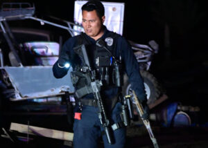 El Centro Police Officer heavily armed at night