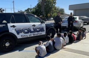 Shafter police department detaining suspect on curb 2