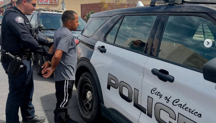 Calexico Police officer arresting civilian