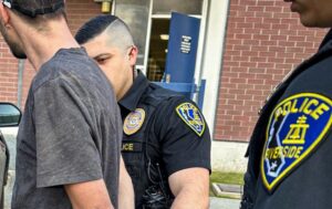 Riverside Police Officers arresting 2