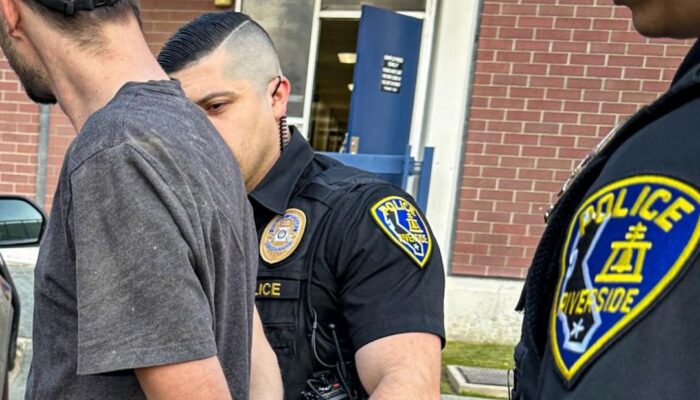 Riverside Police Officers arresting 2