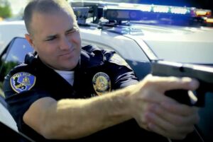 Riverside Police officer pointing gun 3