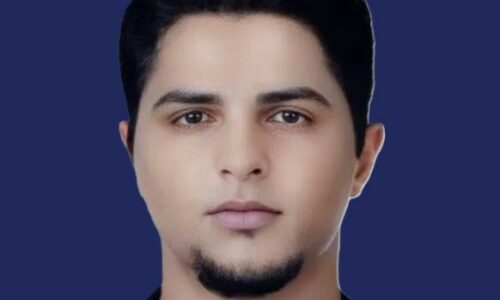 Adam Iza head shot from LA Daily News blue background cropped