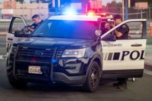 San Fernando Police pointing guns at SFPD car 2