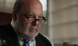 JLS DATELINE AT DESK FROM RIGHT FRONT